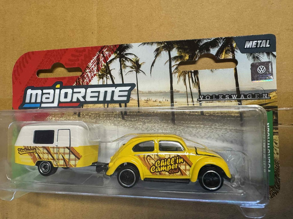 Volkswagon Beetle With Yellow & White Caravan